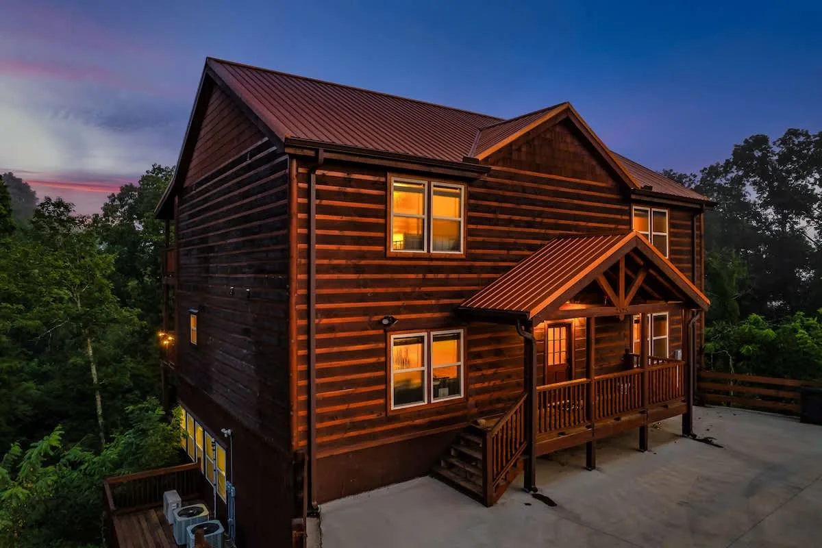 Blue Smoke Lodge exterior at twilight seen from the parking deck